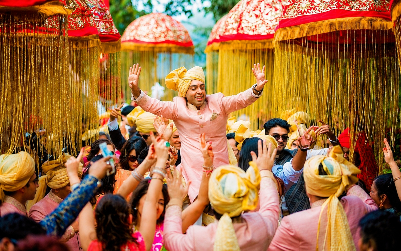 Decorated wedding procession entrance with warm celebration lighting